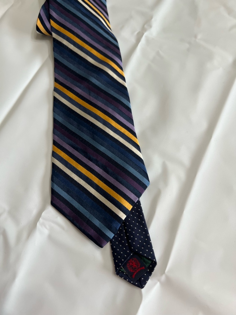 Tommy Hilfiger Classic Men's Striped Silk Tie in Navy, Purple, and Gold. Silk